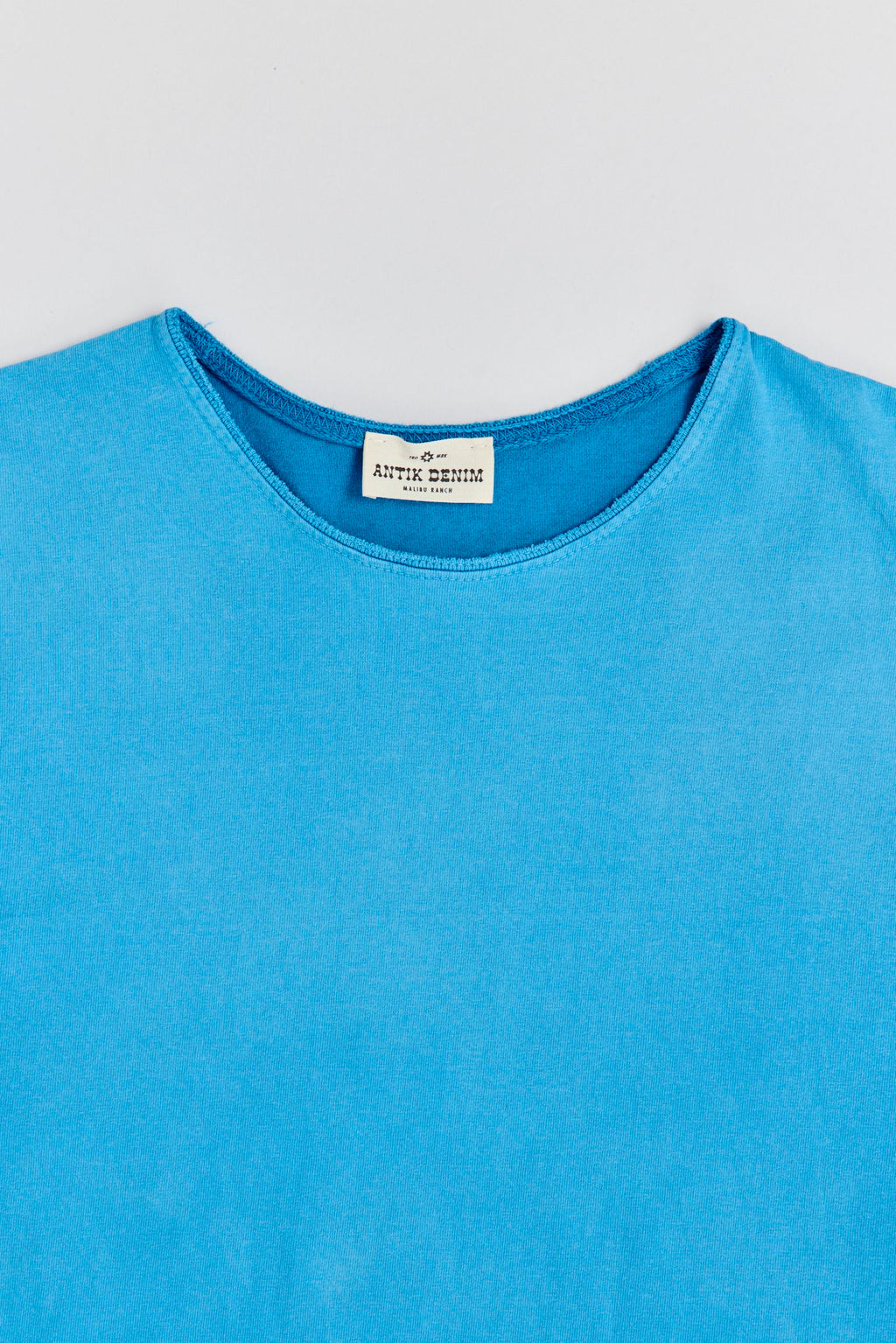 AM9100W TURQUOISE T-SHIRT